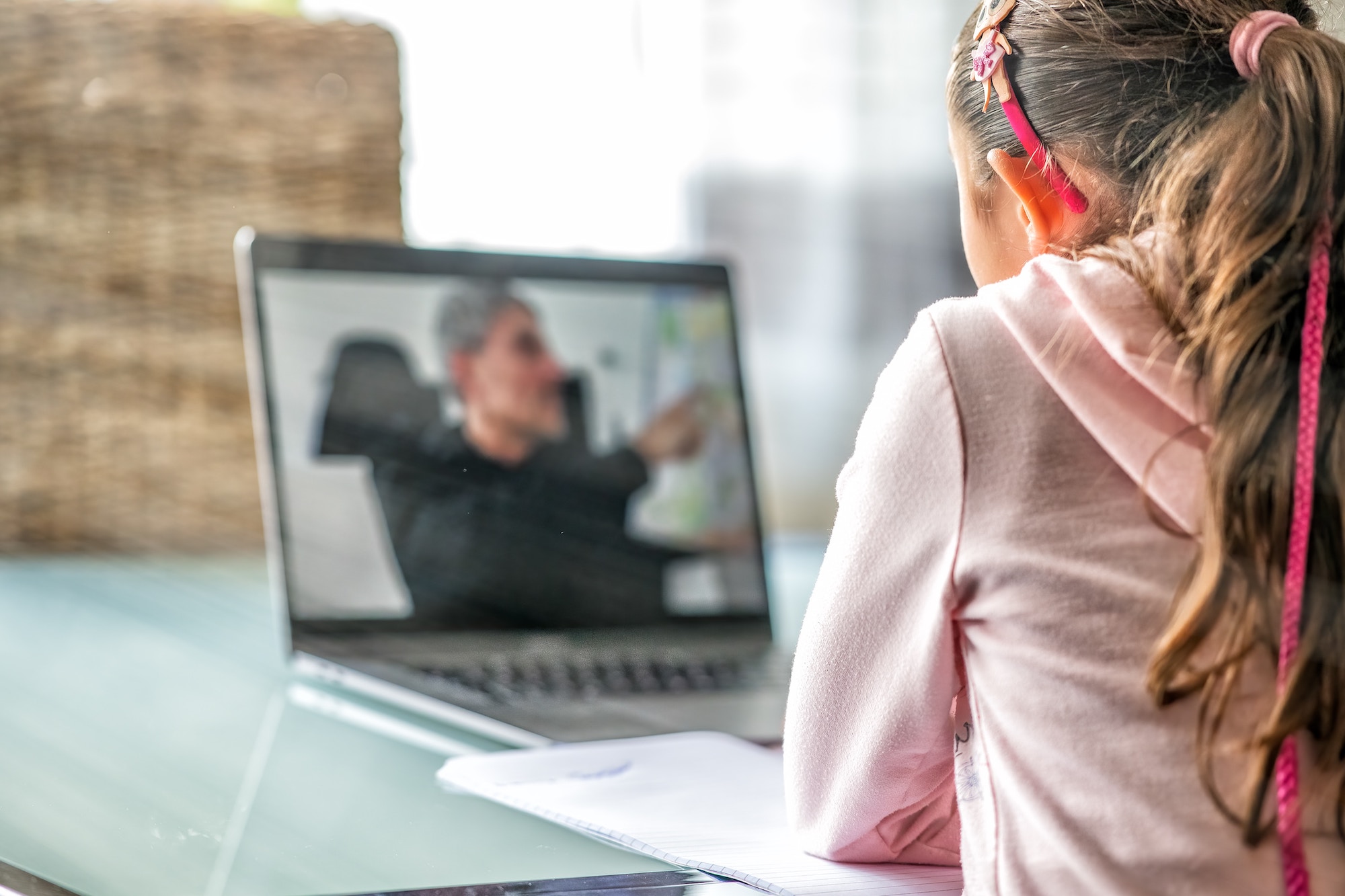 A young girl on a Zoom call learning about entrepreneurship