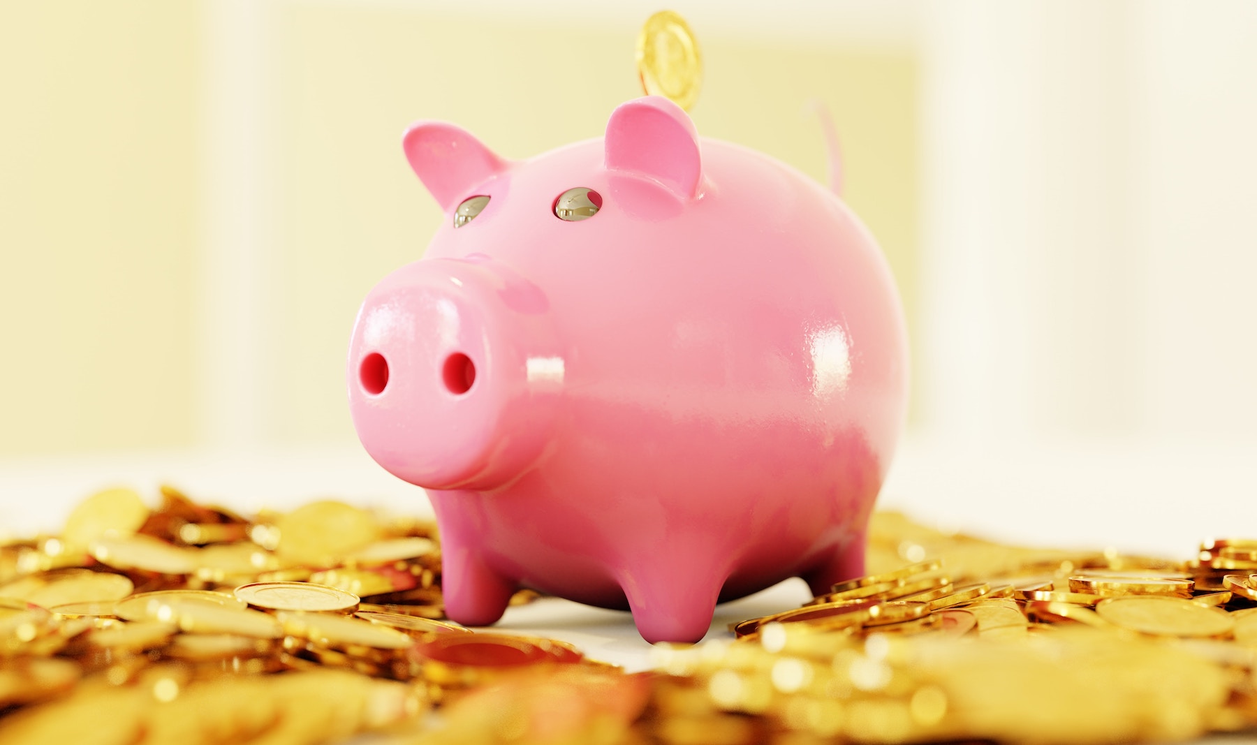 A piggy bank with an abundance of coins around it, teaching kids that money is abundant.